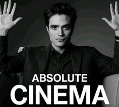 a man sitting in a chair with his hands up and the words absolute movie awards above him