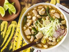 a white bowl filled with beans and vegetables
