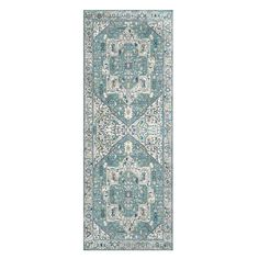 a blue and white rug with an intricate design on the bottom, in front of a white background