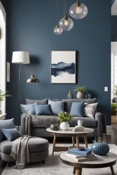 a living room with blue walls and grey furniture in the center, surrounded by potted plants