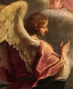 an angel kneeling down with his hands together