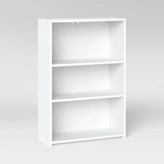 a white bookcase with three shelves on each side