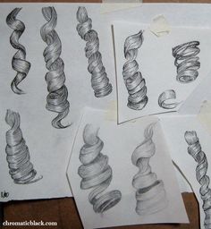 several drawings of spirals are shown on paper