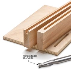 a piece of wood being cut with a pair of scissors