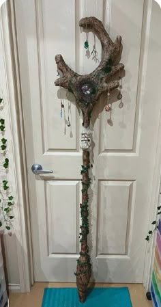a door way with a tree branch decoration on it