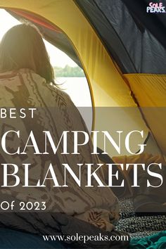 a woman sitting in a tent with the words best camping blankets of 2013 on it
