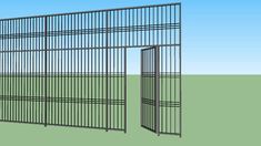 an image of a metal fence that is in the grass