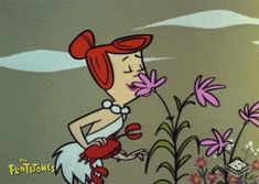 a cartoon character is smelling some flowers