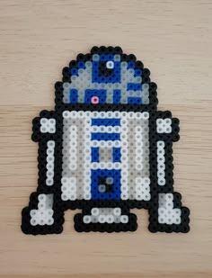 a toy made out of legos sitting on top of a wooden table