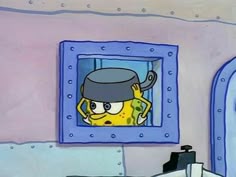 the spongebob is looking at himself in the mirror while he's wearing a hat