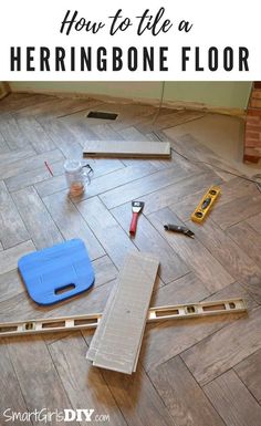 tools are laid out on the floor to be used in construction projects, such as tile