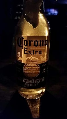 a close up of a bottle of beer on a table