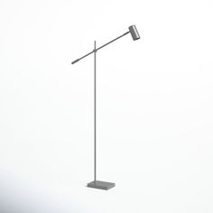 a tall metal pole with two lights on top of it, in the middle of an empty room