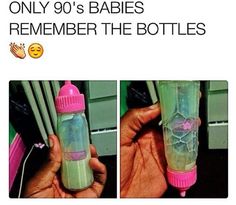 the baby bottle is being held by someone's hand and has pink trim on it