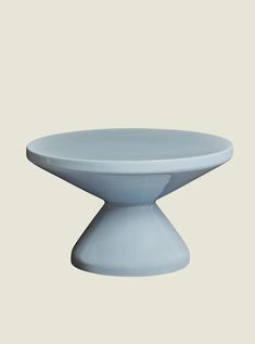 a white cake plate sitting on top of a table