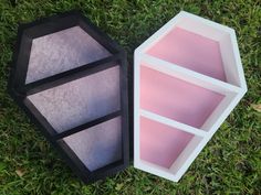 two empty boxes sitting on top of green grass