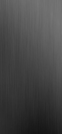 a black and white photo of some metal textured material that looks like it has been brushed