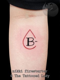 a tattoo with the letter b on it
