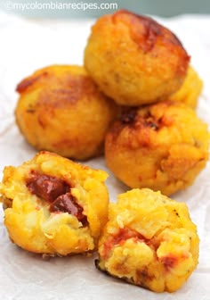 three pieces of food sitting on top of a piece of paper