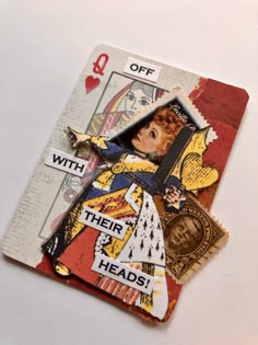 altered collage of playing cards with an image of a woman holding a card and the caption reads, off with their heads