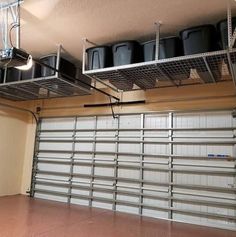 an overhead garage storage unit with hanging pots and pans