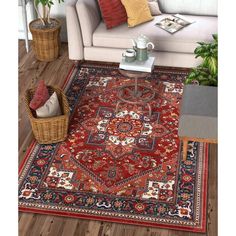 a living room with a couch, coffee table and rug