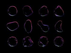different shapes and sizes of soap bubbles on a black background