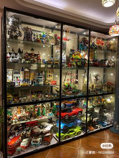 a display case filled with lots of toy cars