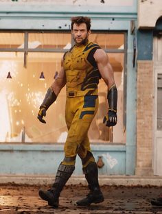 a man dressed as wolverine in front of a building