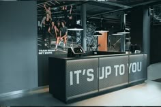 an image of a gym with people doing exercises on the treadmills and it's up to you sign