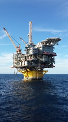 an oil rig in the middle of the ocean