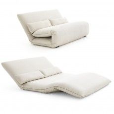 two white couches sitting next to each other