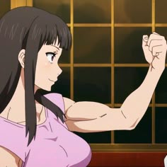 a woman with long black hair is flexing her arm