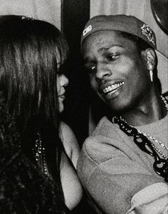 a man and woman standing next to each other