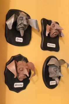 four masks are hanging on the wall