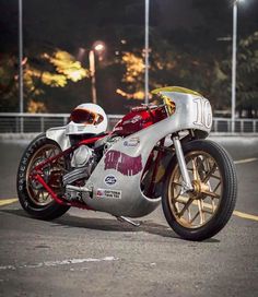 a motorcycle parked in a parking lot at night