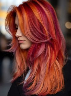 Explore the latest winter hair color ideas for 2024 - 2025. From soft pastels to bold neons, these trending styles will inspire your next salon visit! Vibrant Fall Hair Color, Fun Hair Colors 2025, Sunset Red Hair, Crazy Color Hair Ideas, Sunset Hair Color Ombre, Vibrant Winter Hair Color, Fire Color Hair Ombre, Fire Hair Color Ombre, Ginger Hair With Vivid Color