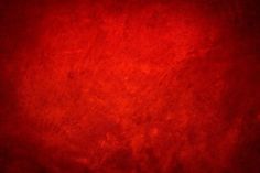 a red background with some black spots on it