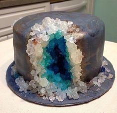 there is a cake that has been decorated with blue and white frosting on it