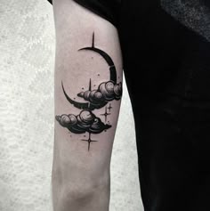 a man's arm with a black and white tattoo on it