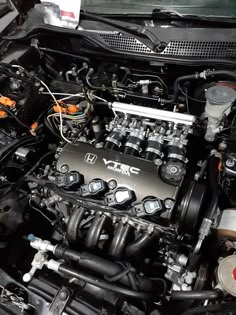 the engine compartment of a car with its hood open