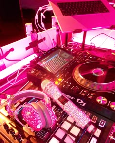 dj equipment with headphones and laptop in background