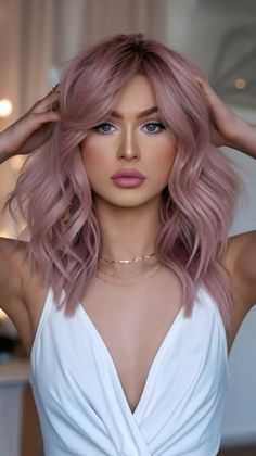 Soft, romantic, and trend-forward, this dusty pink wavy bob adds instant charm and character. The cool pink tones flatter a wide range of skin tones, making it a go-to for Summer Hair Color 2025. With its tousled texture and soft curls, this hairstyle is both photo-ready and effortlessly wearable for day-to-night summer adventures. Dusty Pink Hair Colour, Pink Tone Hair, Fun Hair Color In Your 30s, Romantic Hair Color, Soft Summer Hair Colours, Blush Hair Color, Blonde Hair With Soft Pink Highlights, Hair Colour Ideas Blonde, Trend Hair Color
