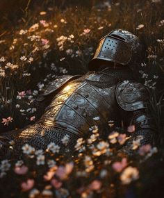 a knight laying in the grass with flowers