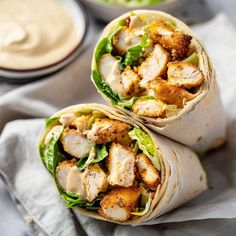 two wraps filled with chicken and lettuce