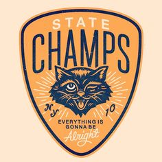 an orange and blue state champs badge with a black cat in the center on it