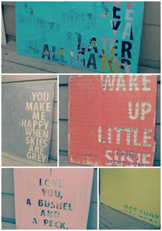 four different types of painted signs on the side of a building with words written on them