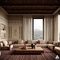 a living room filled with furniture and a large window overlooking the cityscape in the distance