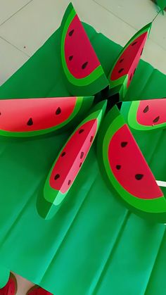a piece of paper that has watermelon slices cut out on top of it