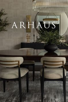 a dining room table and chairs with the words arhauss above it in front of a mirror